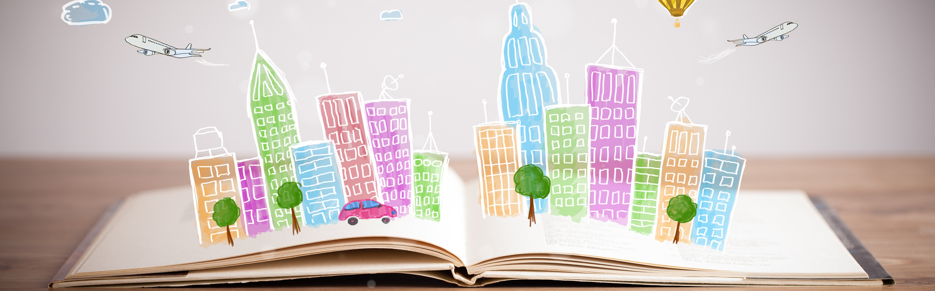 Open book with town illustration